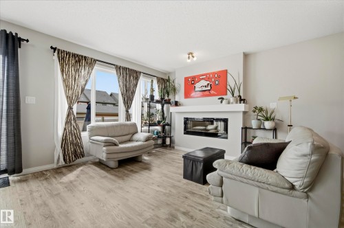 3805 Powell Wynd Sw, Edmonton, AB - Indoor Photo Showing Living Room With Fireplace