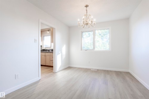 Bright interior with light wood-finish flooring - 17927 80 Avenue Nw, Edmonton, AB 