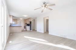 Expansive living space with wood-finish flooring - 