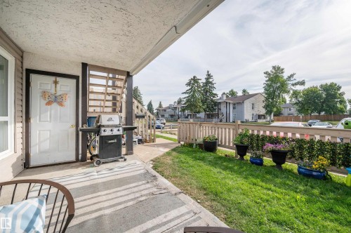 Covered patio with concrete flooring - 15017 26 Street Nw, Edmonton, AB 