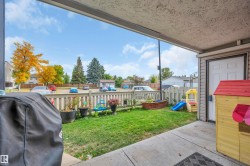 Covered patio area with concrete flooring - 