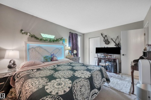 Carpeted flooring, recessed lighting, and a neutral wall color - 15017 26 Street Nw, Edmonton, AB 