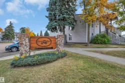 Stone-clad entryway signage with wood-finish panel - 