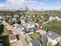 Urban skyline backdrop, residential street, mature trees, and established neighborhood setting - 