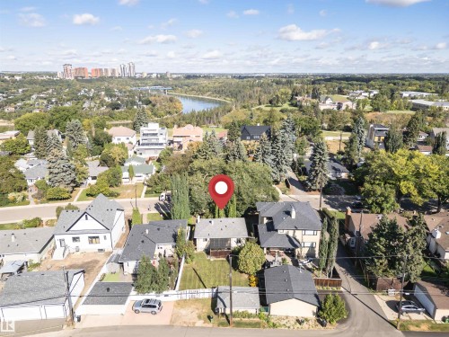 Landscaped lot with mature trees, established neighborhood setting, and detached garage - 8743 Strathearn Drive Nw, Edmonton, AB 