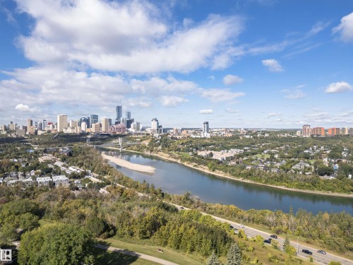 City skyline featuring high-rise buildings, river, and lush tree canopy - 8743 Strathearn Drive Nw, Edmonton, AB 