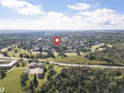 Expansive urban landscape featuring dense residential areas and substantial green spaces - 