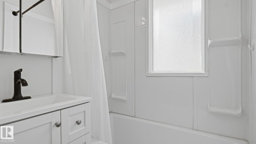 White vanity cabinet with silver-tone hardware - 11836 62 Street Nw, Edmonton, AB 