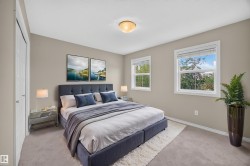 Soft neutral wall tones, carpeted flooring, and a flush mount ceiling light fixture - 