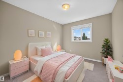 Neutral wall color, carpeted flooring, white ceiling, flush-mount ceiling light, and a white-framed window - 