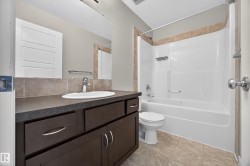 Vanity with dark cabinetry and a vessel sink - 