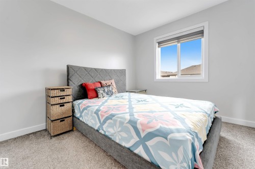 Carpeted flooring, white trim, and a window with a roller shade - 2004 15 Avenue Nw, Edmonton, AB 