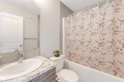 Vanity with integrated sink, stone-finish countertop, and chrome faucet - 