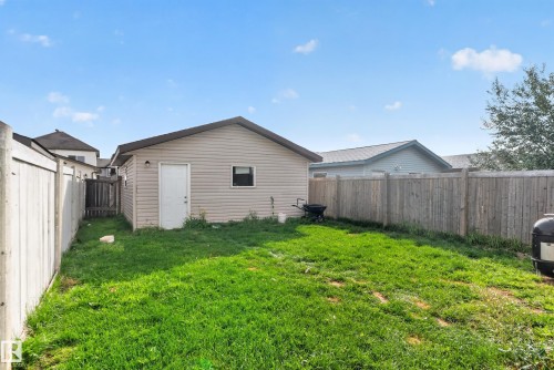 Detached garage with siding exterior and a single entry door - 7817 Schmid Place Nw, Edmonton, AB 