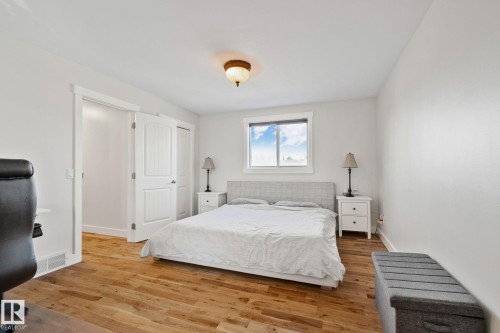 Wood-finish flooring, white trim, recessed window, and overhead lighting - 12403 29A Avenue Nw, Edmonton, AB 