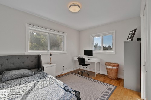 Hardwood flooring with a light finish, white walls, and a semi-flush mount ceiling light fixture - 12403 29A Avenue Nw, Edmonton, AB 