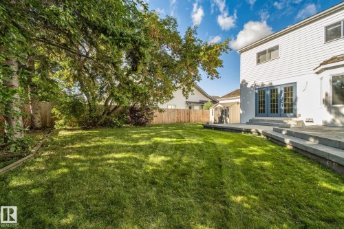 Expansive lawn with mature trees and a fenced perimeter - 12403 29A Avenue Nw, Edmonton, AB 