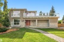 Stucco exterior with stone veneer accents, double entry doors, multiple balconies with glass railings, and a paver walkway - 14103 60 Avenue Nw, Edmonton, AB 