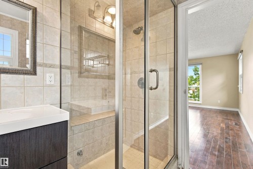 Tiled shower with glass enclosure and built-in bench - 14103 60 Avenue Nw, Edmonton, AB 