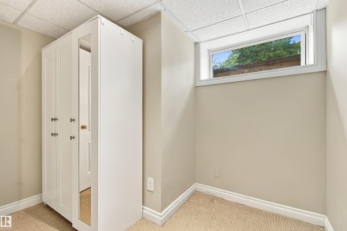 Recessed window with white trim, neutral wall color, and carpeted flooring - 14103 60 Avenue Nw, Edmonton, AB 