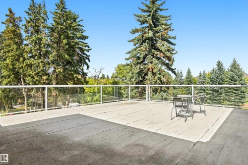 Expansive outdoor patio with glass panel railing - 14103 60 Avenue Nw, Edmonton, AB 