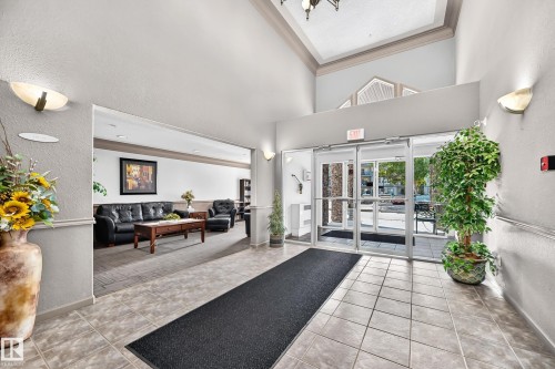 Tiled entry flooring, expansive glass doors, and recessed lighting - #133 16311 95 St Nw, Edmonton, AB 