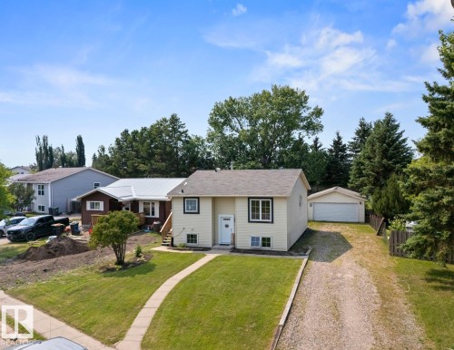 Split-level residence featuring a light-colored exterior with dark trim accents - 1801 Forest Drive, Cold Lake, AB - Outdoor