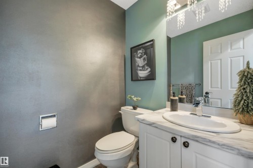 Vanity with white cabinetry, oval sink, and a light-toned countertop - #13 6608 158 Av Nw, Edmonton, AB 