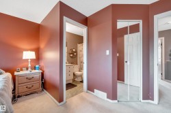 Carpeted flooring, mirrored closet doors, and painted interior walls - 