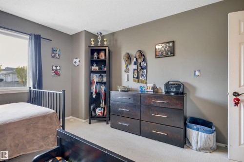 Light gray wall paint, white trim, and a window with dark curtains - #13 6608 158 Av Nw, Edmonton, AB 