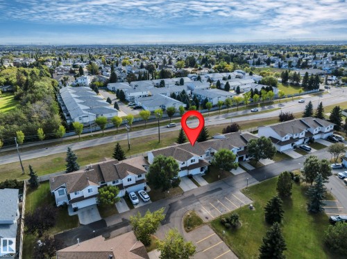 Townhome-style residences with attached garages and paved driveways - #13 6608 158 Av Nw, Edmonton, AB 