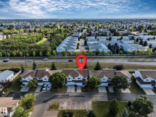 Townhouse community with individual garages and mature landscaping - #13 6608 158 Av Nw, Edmonton, AB 