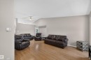 Vaulted ceilings with a ceiling fan, light wood-finish flooring, and neutral wall tones - 365 Hollick-Kenyon Road Nw, Edmonton, AB 