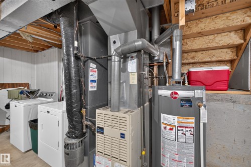 Utility area with washer, dryer, water heater, and furnace - 365 Hollick-Kenyon Road Nw, Edmonton, AB 