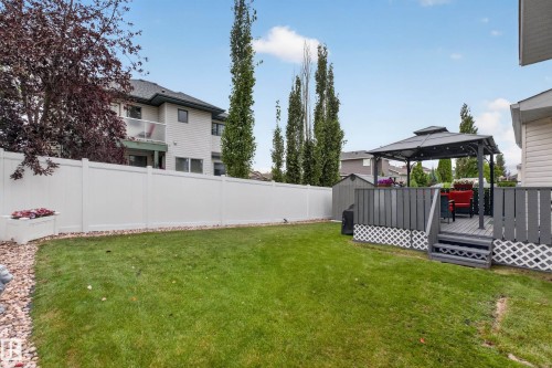 Manicured lawn with a privacy fence, an elevated deck, and a gazebo - 365 Hollick-Kenyon Road Nw, Edmonton, AB 