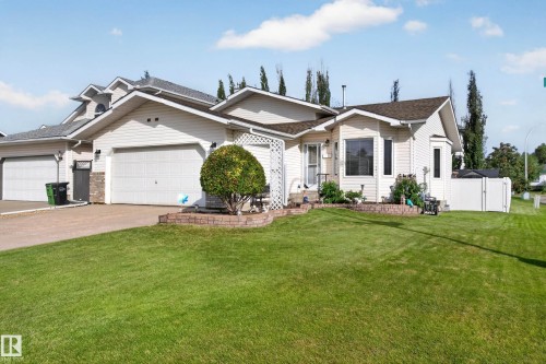 Siding exterior with a double garage and a single garage - 365 Hollick-Kenyon Road Nw, Edmonton, AB 