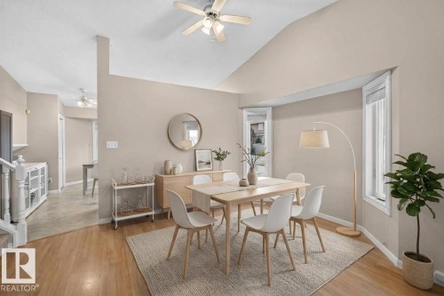 Vaulted ceiling, wood-finish flooring, bay windows, ceiling fan, and built-in cabinetry - 365 Hollick-Kenyon Road Nw, Edmonton, AB 