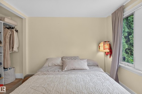 Window with a tree-lined backdrop and integrated shelving system - 11308 123 Street Nw, Edmonton, AB 