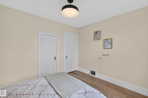 Recessed lighting fixture, light wood-finish flooring, two panel doors with classic hardware, painted walls, and white trim - 11308 123 Street Nw, Edmonton, AB 