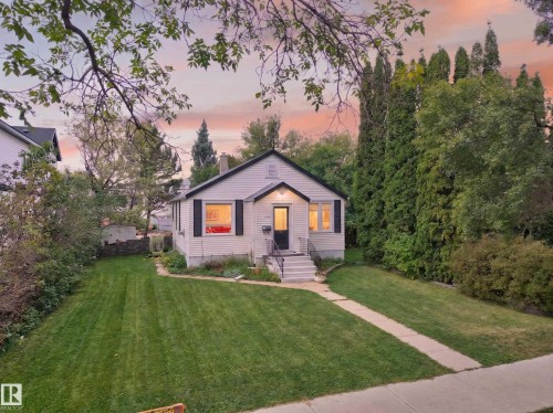 Gable-roof property featuring horizontal siding and dark shutters - 11308 123 Street Nw, Edmonton, AB 
