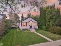 Gable-roof property featuring horizontal siding and dark shutters - 11308 123 Street Nw, Edmonton, AB 