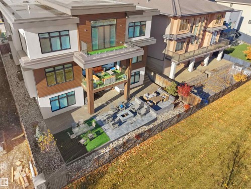 Multi-level modern exterior with wood-finish siding accents - 4809 Woolsey Lane Nw, Edmonton, AB 
