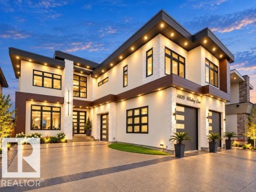 Contemporary exterior featuring stone accents and wood-finish detailing - 4809 Woolsey Lane Nw, Edmonton, AB 