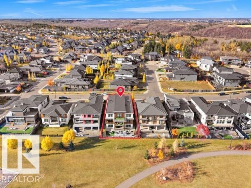 Multi-level townhome with a flat roofline and exterior balconies - 4809 Woolsey Lane Nw, Edmonton, AB 