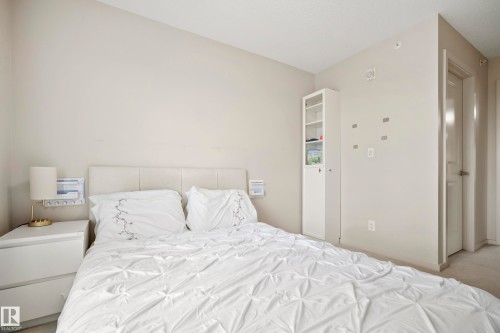 White door with brushed nickel hardware - #419 5515 7 Av Sw, Edmonton, AB 