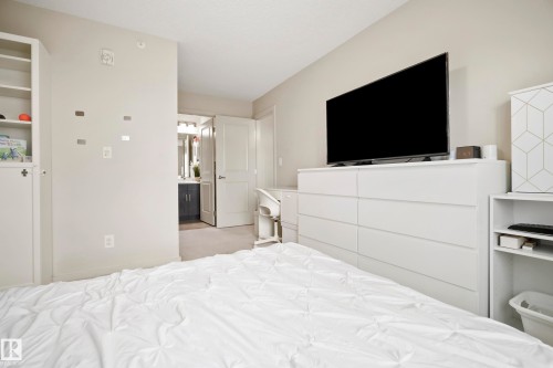 Neutral wall color and carpeted flooring - #419 5515 7 Av Sw, Edmonton, AB 