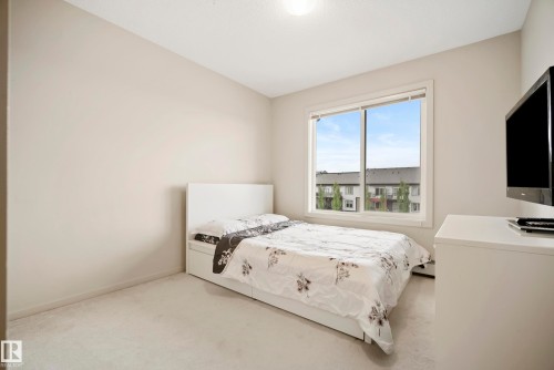 Neutral-toned walls complement the light-colored carpeting - #419 5515 7 Av Sw, Edmonton, AB 