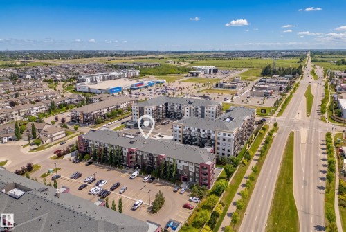 Multi-story residential buildings featuring balconies and surface parking - #419 5515 7 Av Sw, Edmonton, AB 