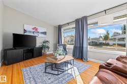 Vaulted ceiling, wood-finish flooring, large window, kitchen pass-through, recessed lighting - 