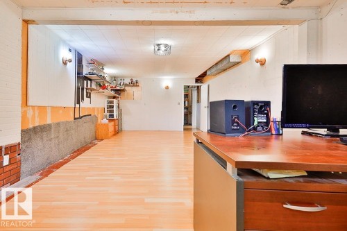 Wood-finish flooring with a drop ceiling and integrated lighting - 13312 123A Street Nw, Edmonton, AB 